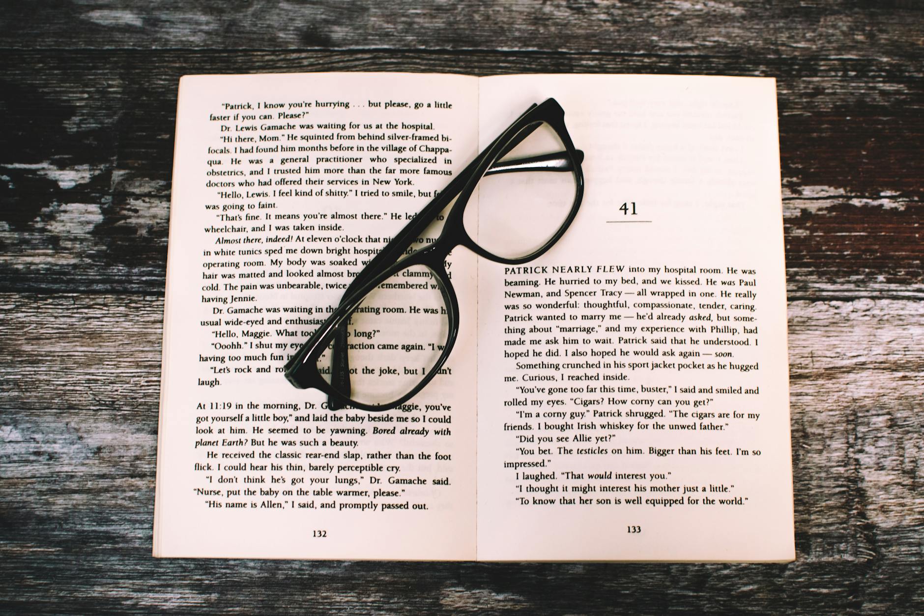 photography of eyeglasses on top of book